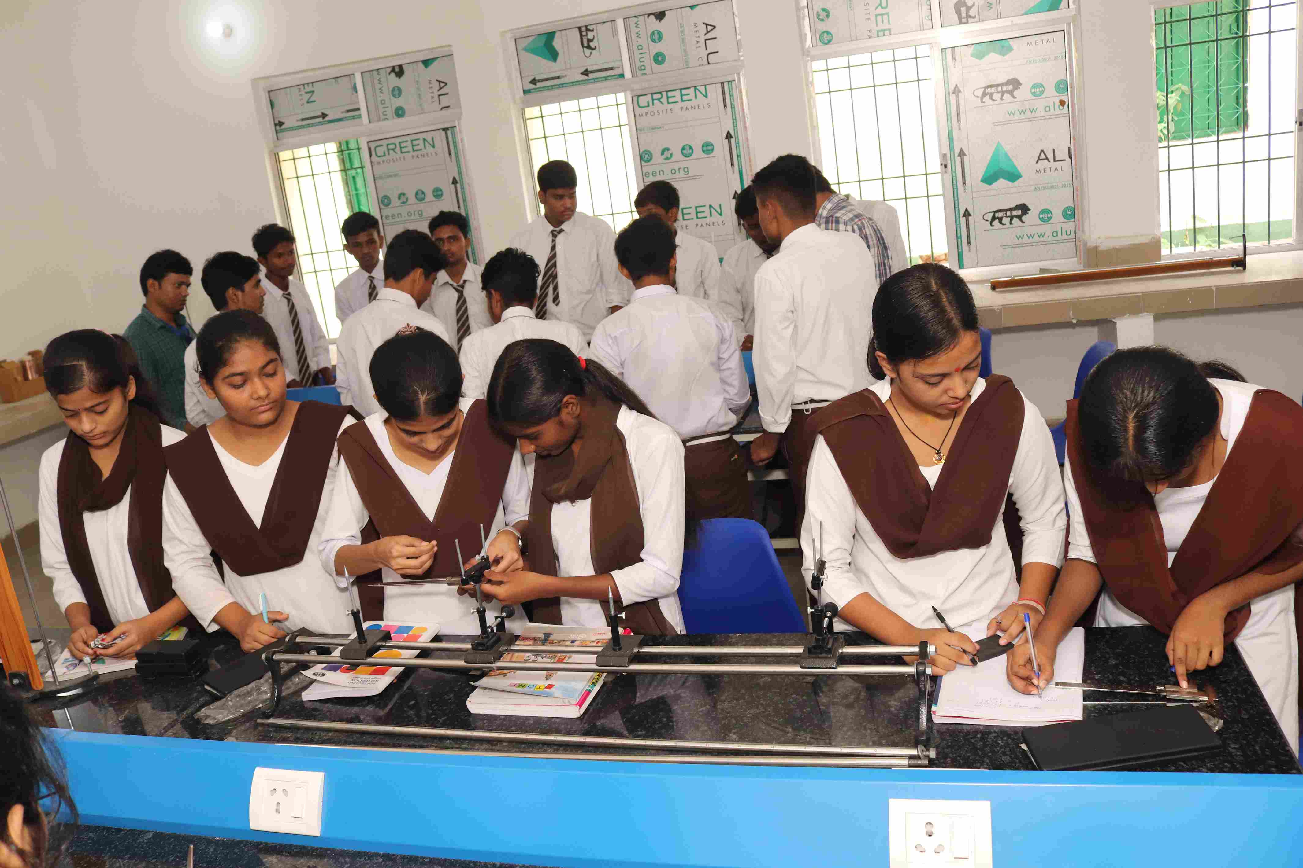 Students conducting experiments in Physics Lab